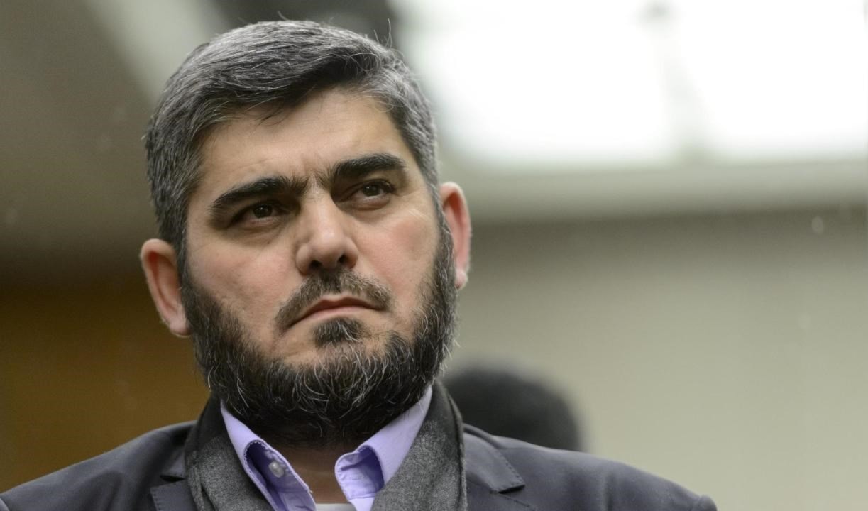 قال علوش للفصائل المسلحة إنه لن يقبل أي "تنازل عن أهداف الثورة" قال علوش للفصائل المسلحة إنه لن يقبل أي "تنازل عن أهداف الثورة"