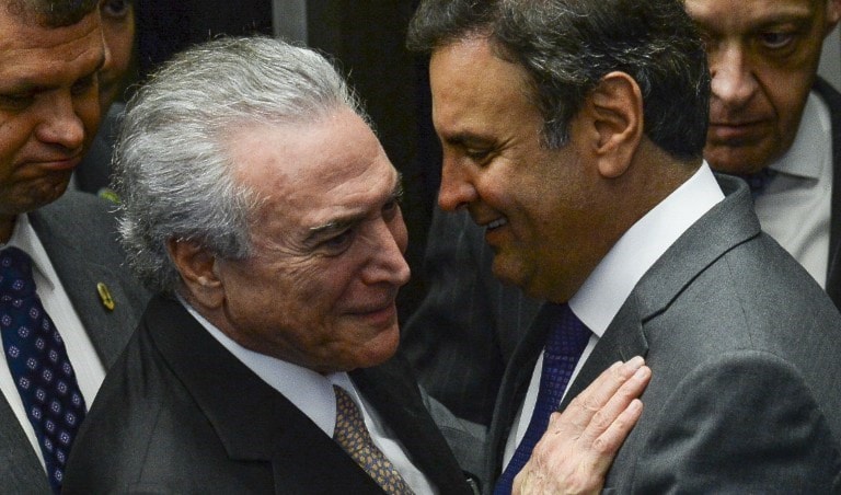 الرئيس البرازيلي مع حليفه الأقرب ايشو نيفيس قبل عام (أ ف ب) الرئيس البرازيلي مع حليفه الأقرب ايشو نيفيس قبل عام (أ ف ب)