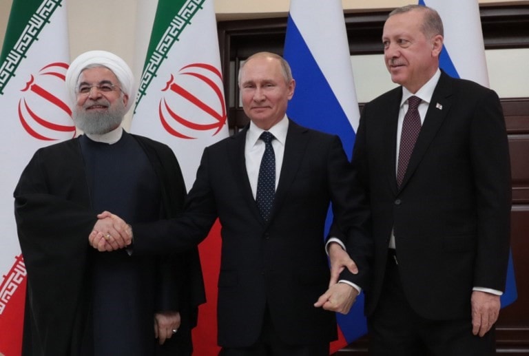 من قمة سوتشي بين بوتين وروحاني وإردوغان (أ ف ب) من قمة سوتشي بين بوتين وروحاني وإردوغان (أ ف ب)
