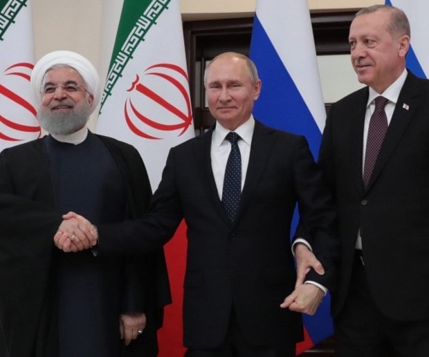 من قمة سوتشي بين بوتين وروحاني وإردوغان (أ ف ب) من قمة سوتشي بين بوتين وروحاني وإردوغان (أ ف ب)