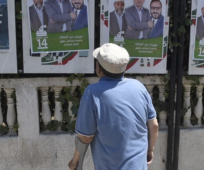 A man looks at election posters for candidates of the "Justice and Development Front" political party in Algeria (AFP). A man looks at election posters for candidates of the "Justice and Development Front" political party in Algeria (AFP).