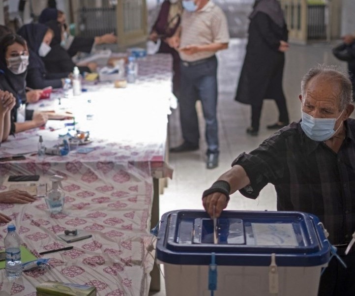 A citizen casts his vote in the Iranian presidential elections (AFP) A citizen casts his vote in the Iranian presidential elections (AFP)