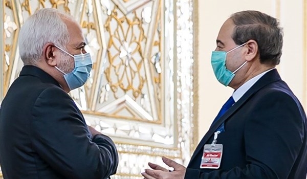وزير الخارجية الإيراني مستقبلاً نظيره السوري في طهران
