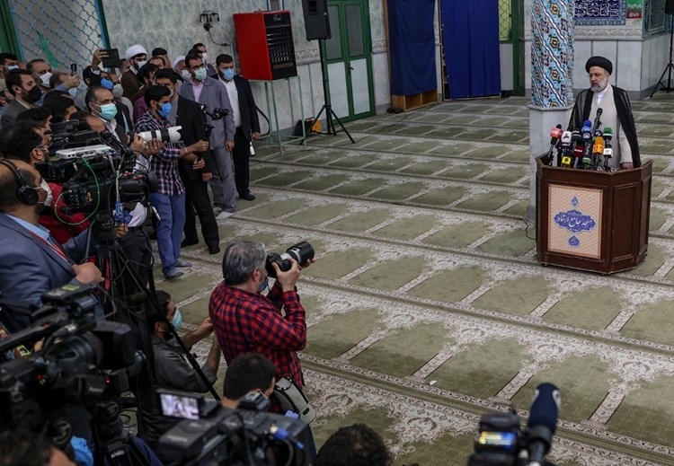 Raisi holds a press conference at a polling station in Tehran - June 18 (AFP).