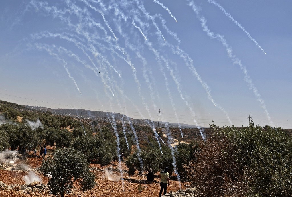 Bombs fired by the Israeli occupation forces among Palestinian civilians near Nablus (AFP).