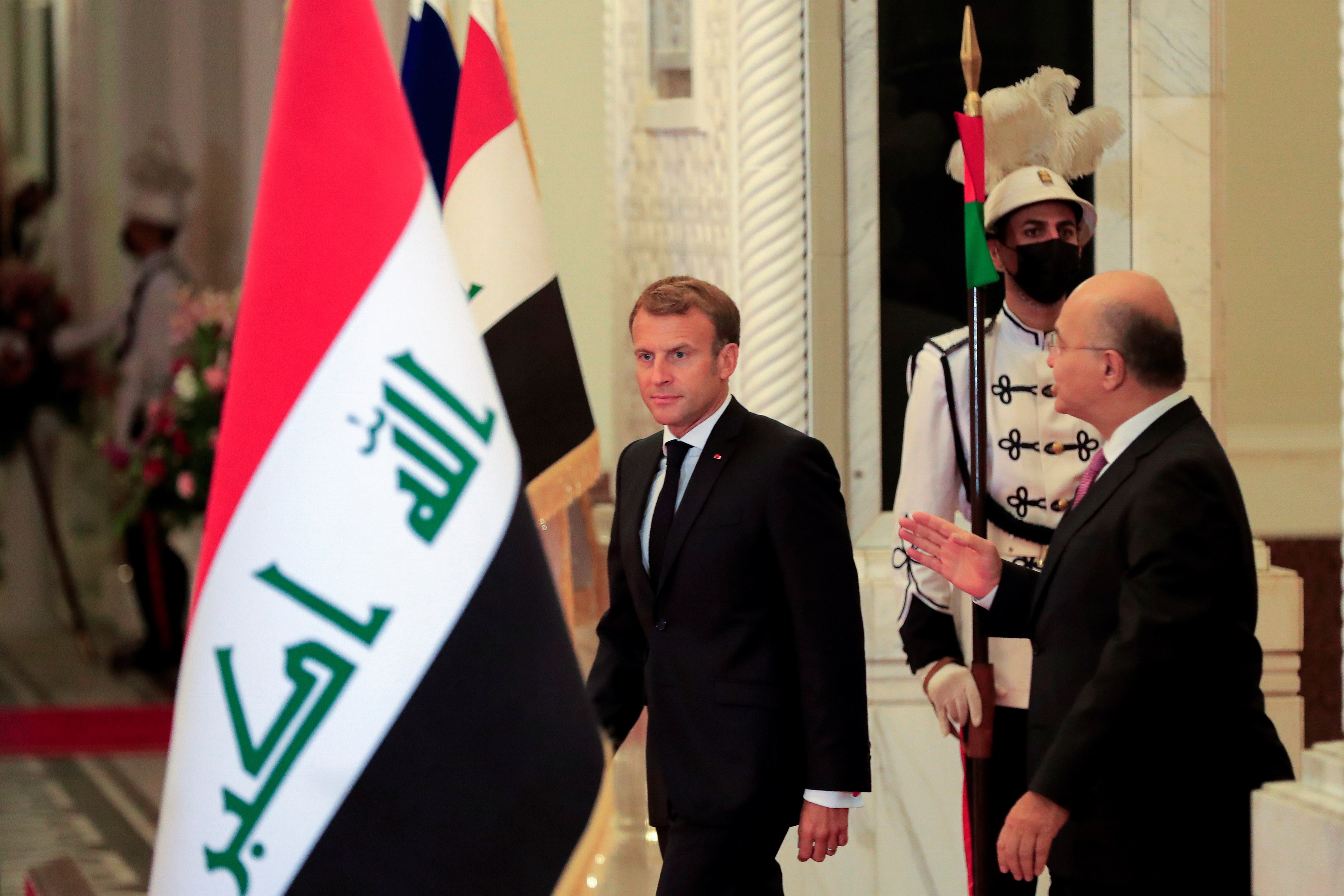 Iraq's President Barham Salih and France's President Emmanuel Macron attend a news conference ahead of the Baghdad summit at the Green Zone in Baghdad, Iraq August 28, 2021 | Reuters